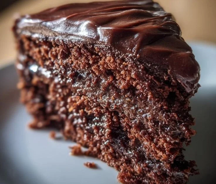 Deliciously moist Christmas chocolate cake decorated with festive toppings
