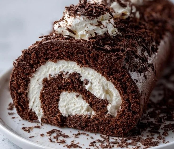 Delicious Christmas Log Cake decorated with festive elements for the holiday season.